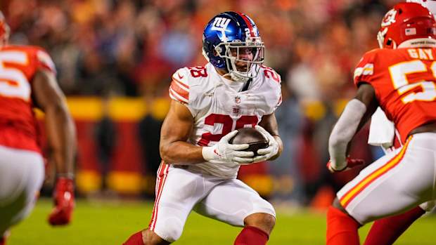 Giants running back Devontae Booker runs against the Chiefs defense.